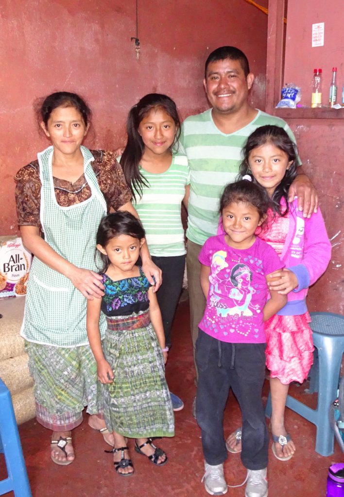 Maria and Jose stand with their four girls in the space they rented on July 4, 2017. Photo: Juliana Anderson.