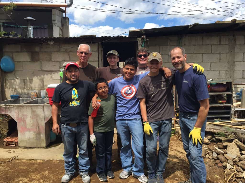 Local contractor Carlos, front left, and interpreter, Victorino, front center, stand with volunteers from Northview Bible Church next to the project site.