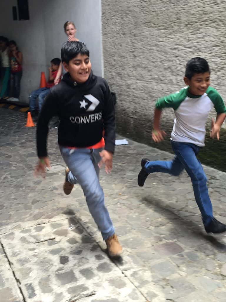 Two kids race at Escuela Integrada during a muscle workshop taught by volunteers from Northview Bible Church.