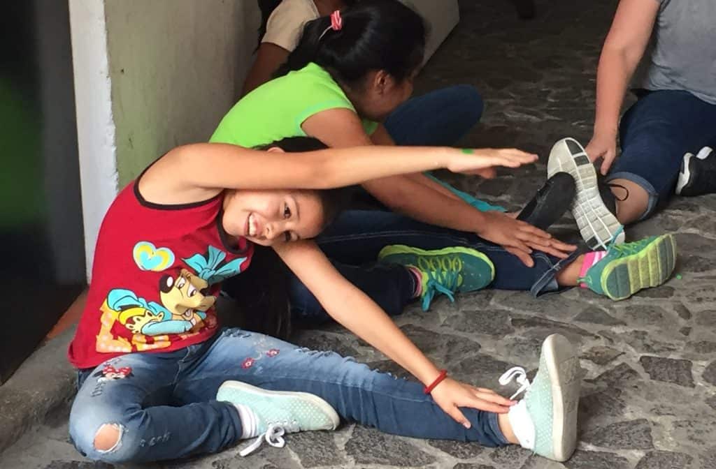 A student at Escuela Integrada practices a stretch she learned during a workshop with volunteers from Northview Bible Church.