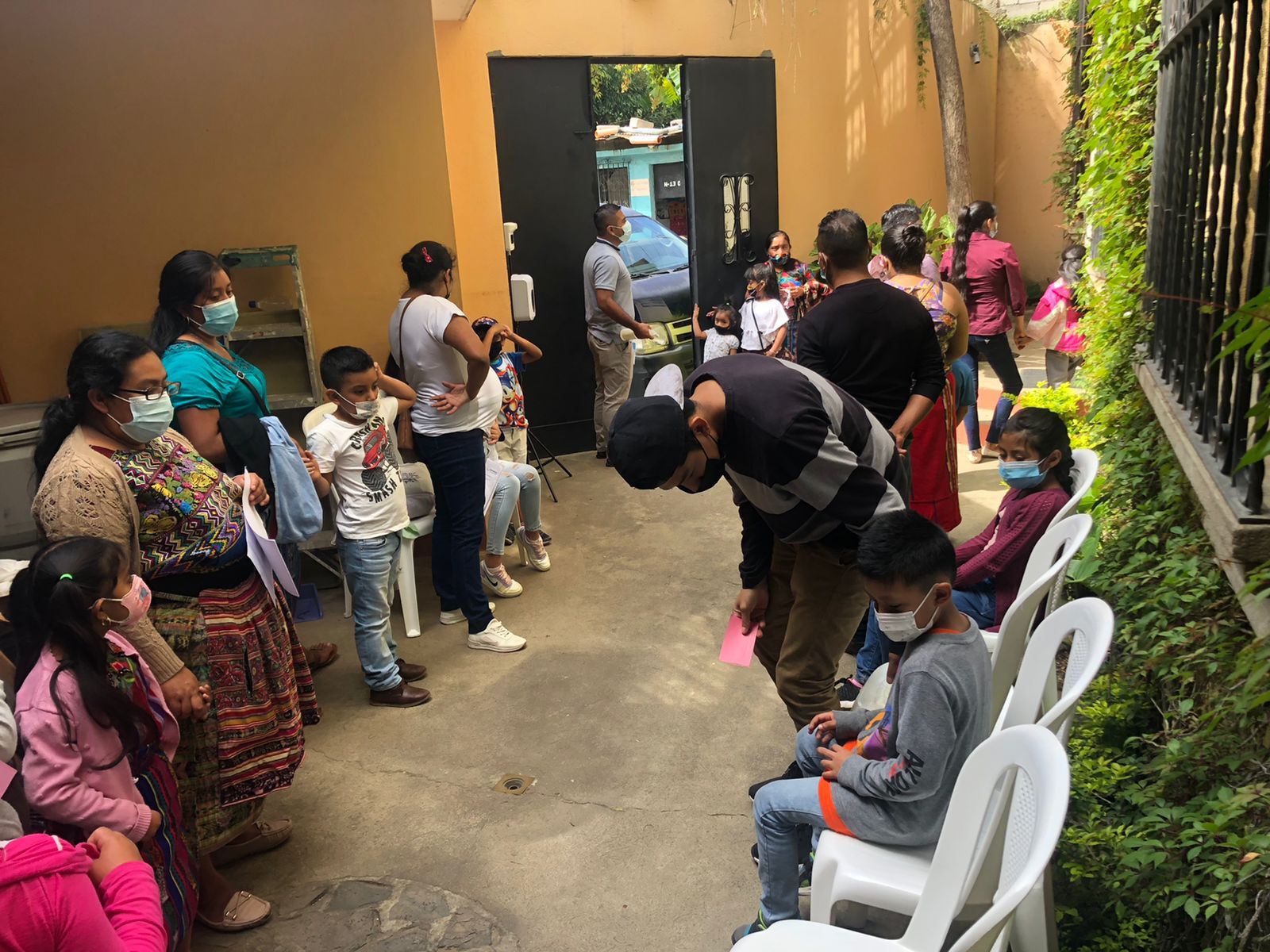 Students and parents wait to enroll at Escuela Integrada’s new location.