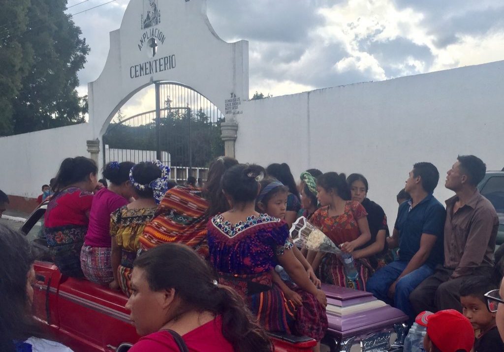 Funeral2 Maria Fernanda, 11, Evelyn, 9, Norma, 8, and Anita, 4, ride in the back of a truck with family members and the casket of their mother. Maria, 37, died Saturday, Aug. 5, 2017. Photo: Autumn Jones.