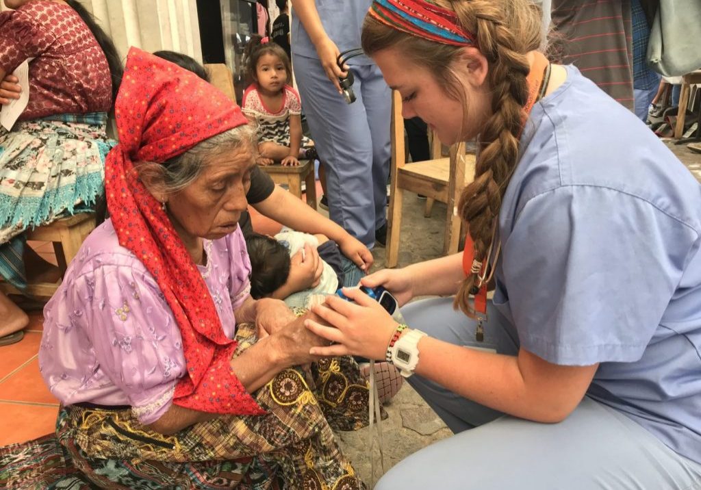 IMG_2724 A nurse with International Medical Relief checks the vital signs for a patient at Escuela Integrada on June 25, 2018.