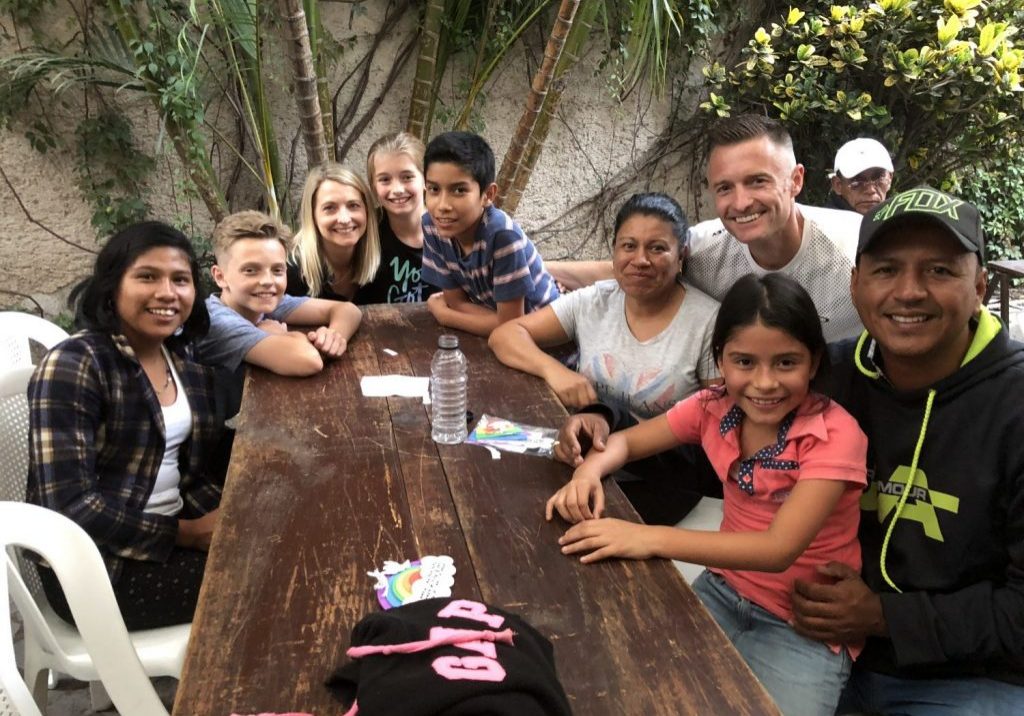 Olsons_3 Mike, Jaime, Reese and Landon Olson spent time with the kids they sponsor and their family at an Escuela Integrada family night on June 12, 2018.